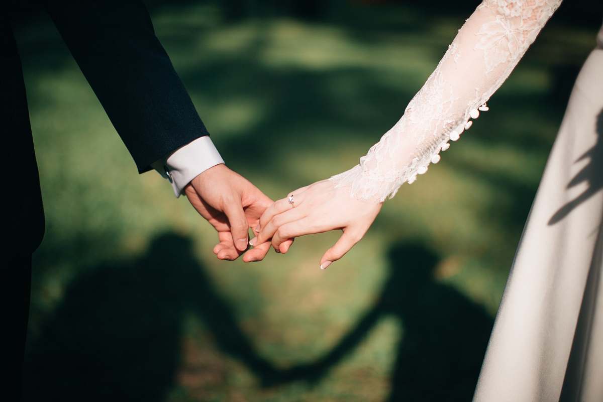 holding hands man and woman holding hands focus photo wedding